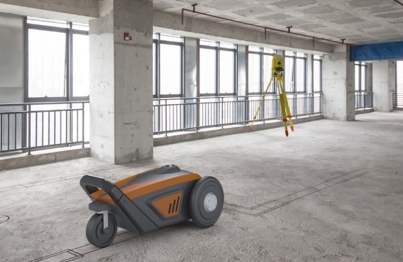 Dusty Robotics FieldPrinter robot automating floor plan layouts at Allegiant Stadium, printing digital models onto concrete slabs.