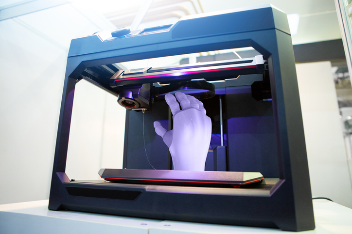 Artificial hand in 3D printer.