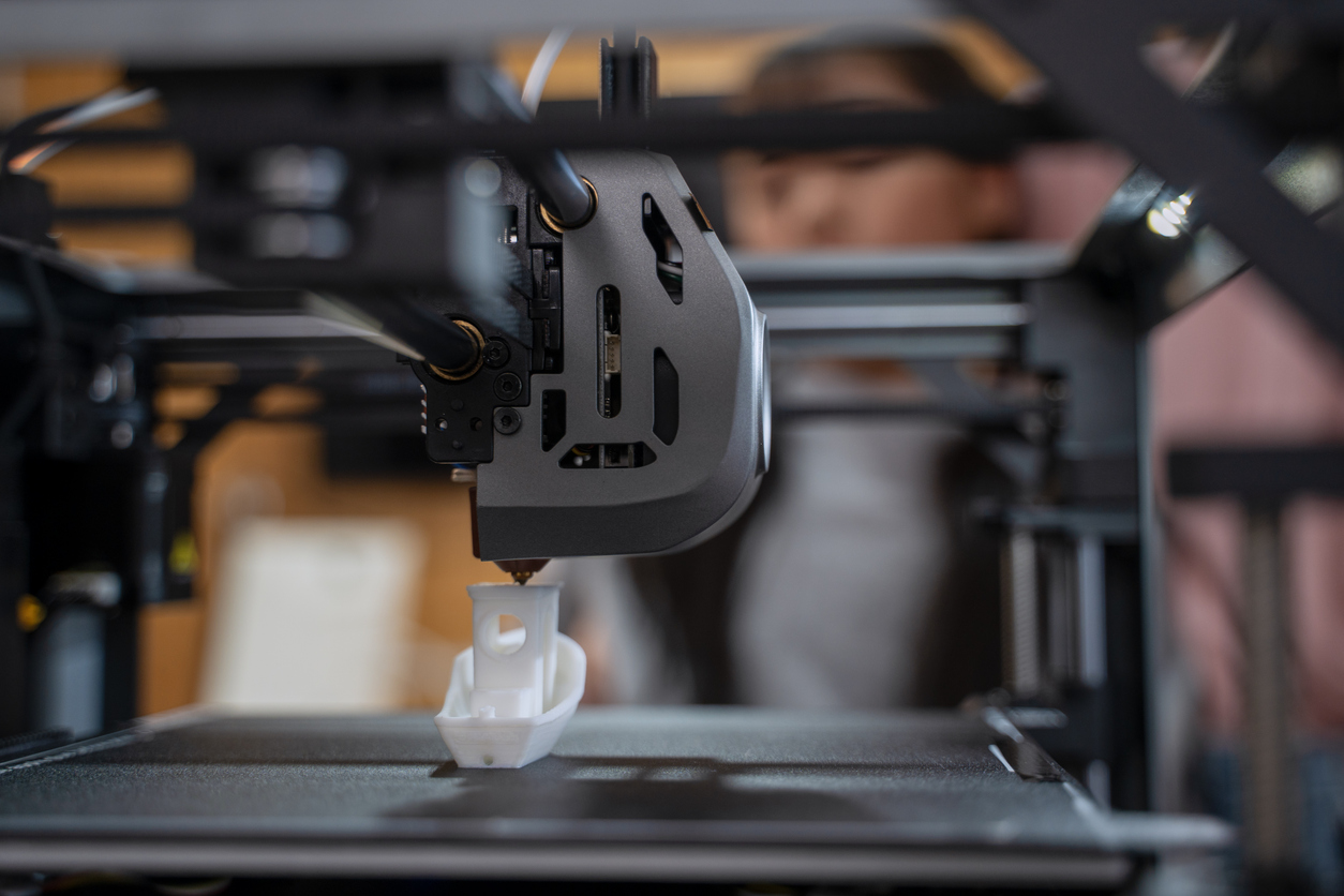  3d printer operating at a workshop. 