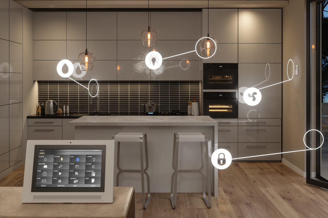 Smart home control system in kitchen with digital tablet showing home automation app icons.