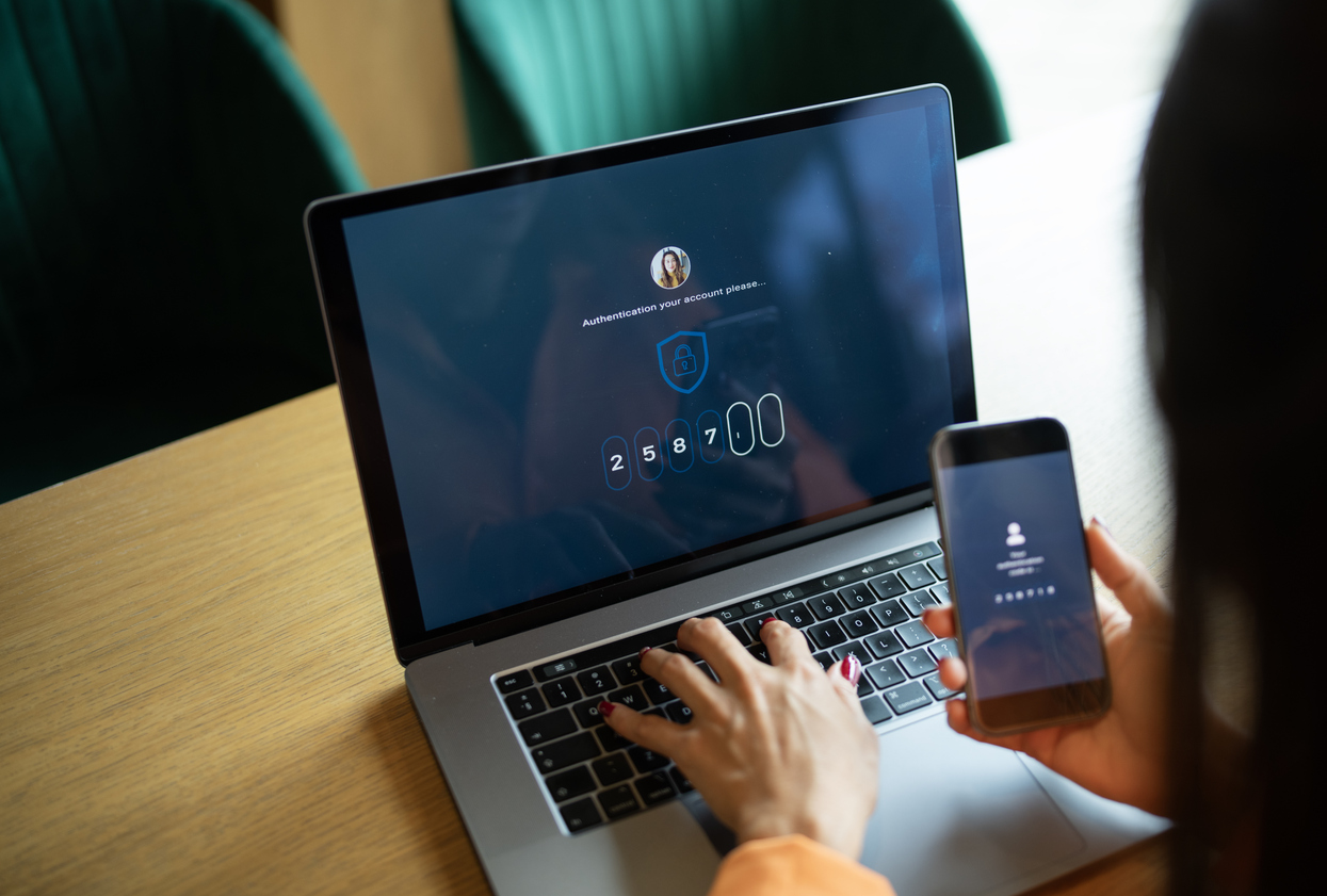 Woman logging in via two-step verification to fortify cybersecurity. 