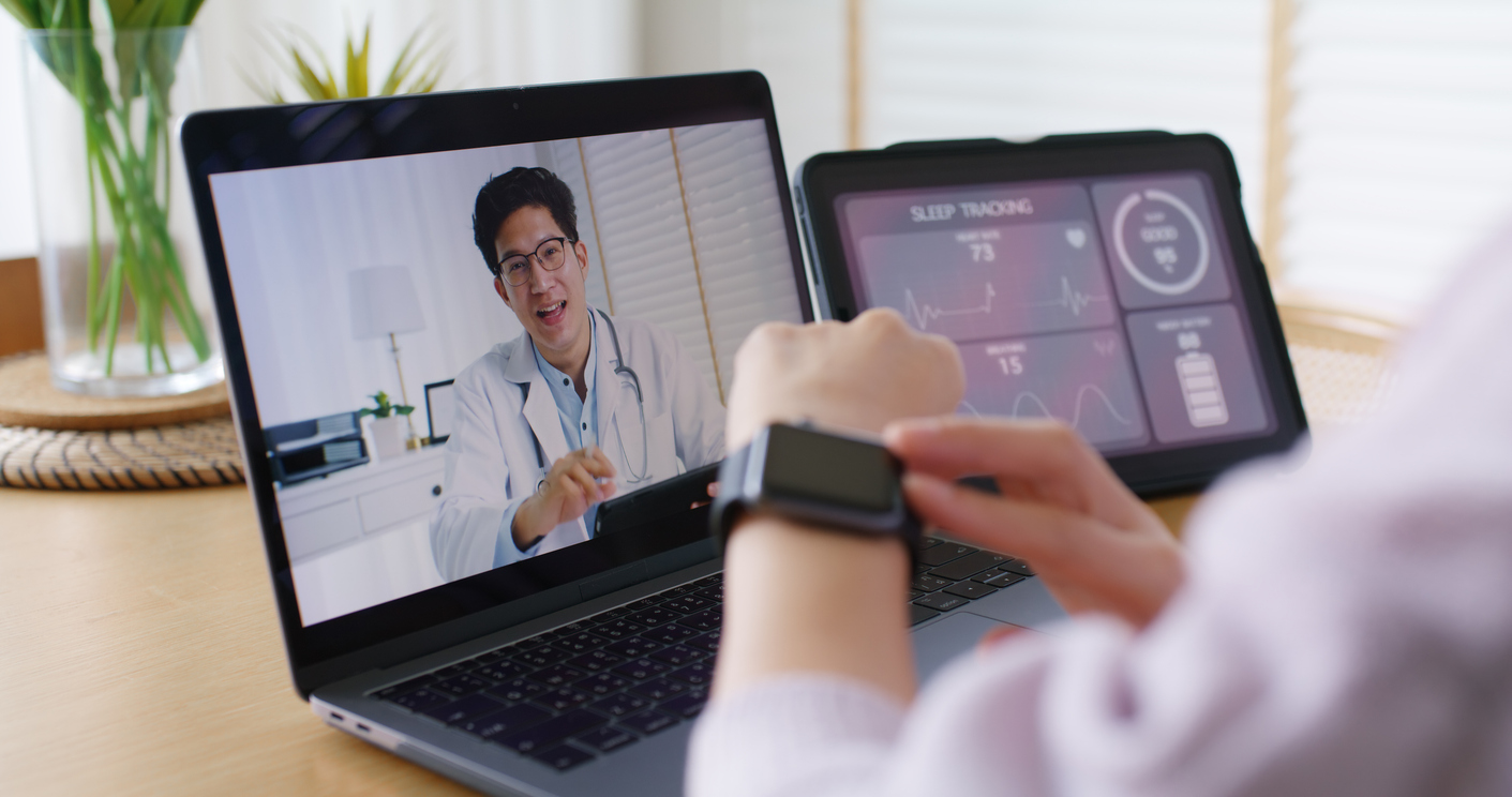 Person on a telehealth video call using a connected device that collects heart, ECG, and sleep data for remote monitoring.