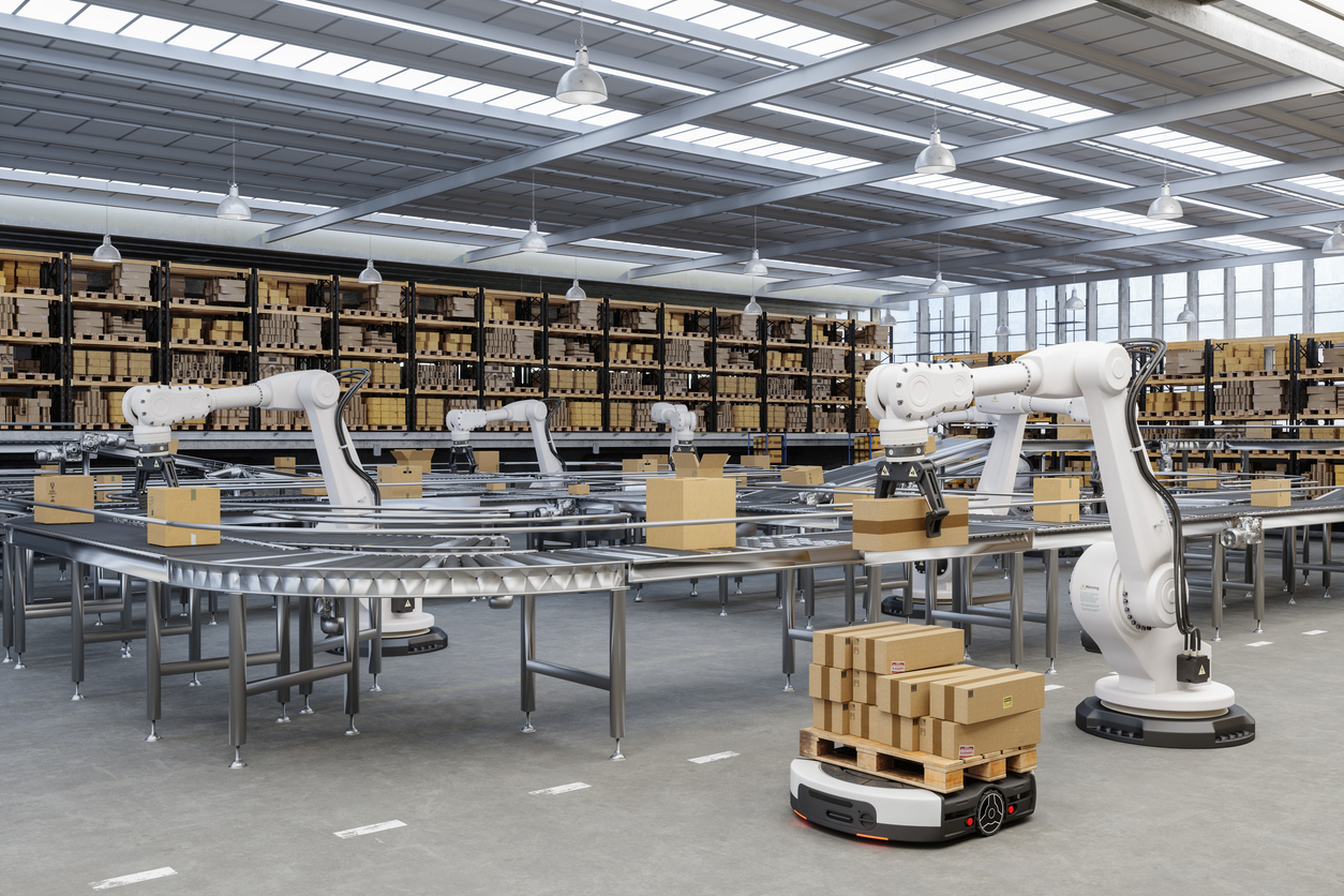 Automation in a smart warehouse using AGVs and robotic arms.