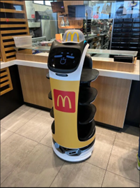 McDonald's robotic assistant with display of a cartoon-like face.
